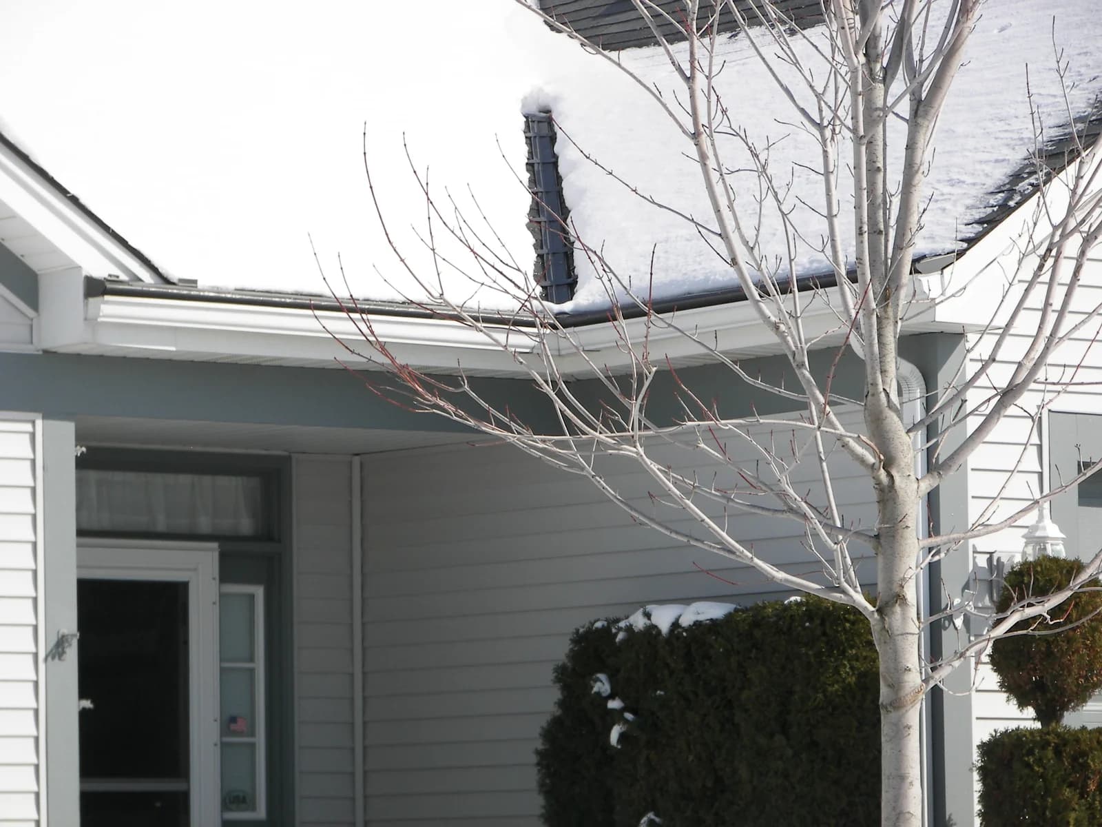 Ranch home with heated gutter protection system